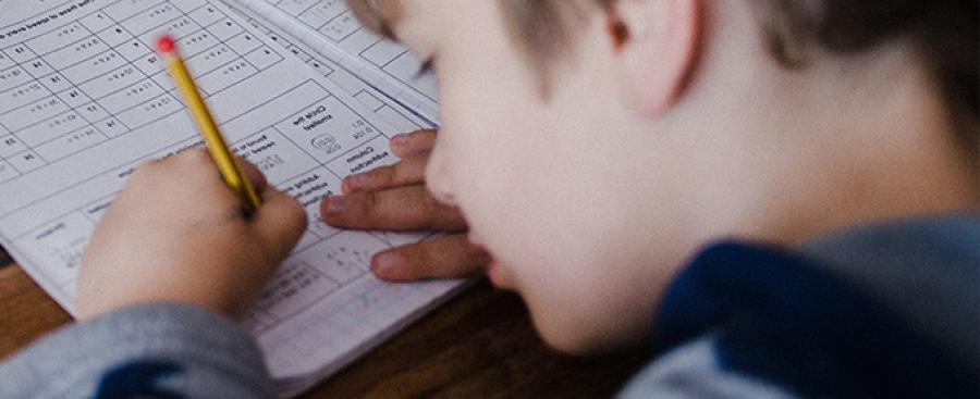 Young boy doing math problems