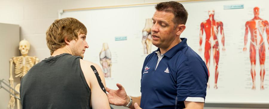 Chris Crawford working with a student athlete